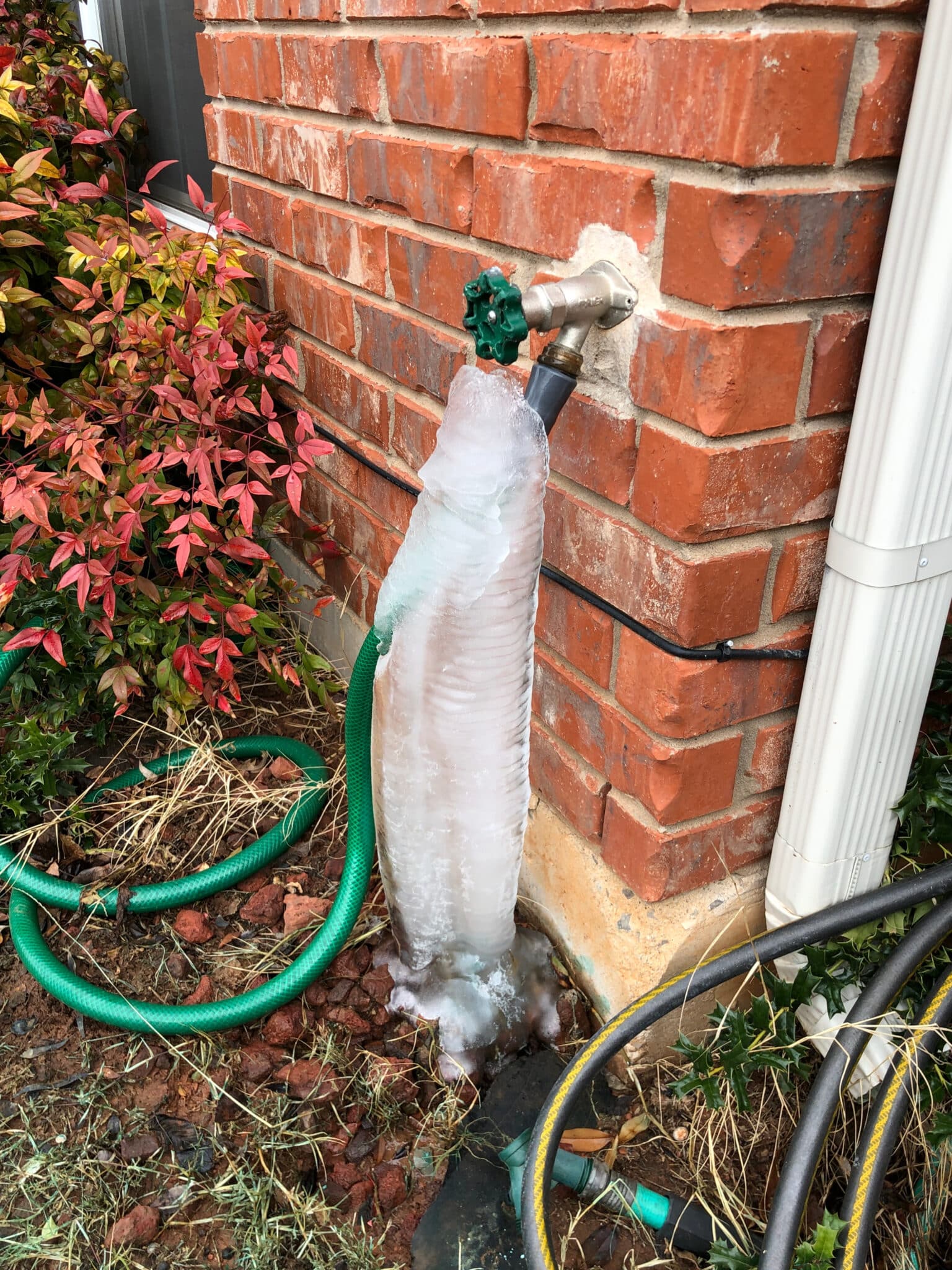 Water from a faucet frozen in winter, Outdoor Spigots.